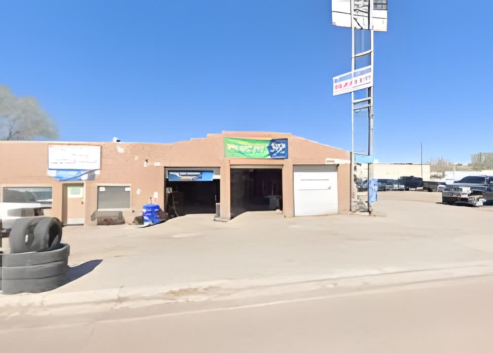 American Muffler shop on 9th Street with signage visible